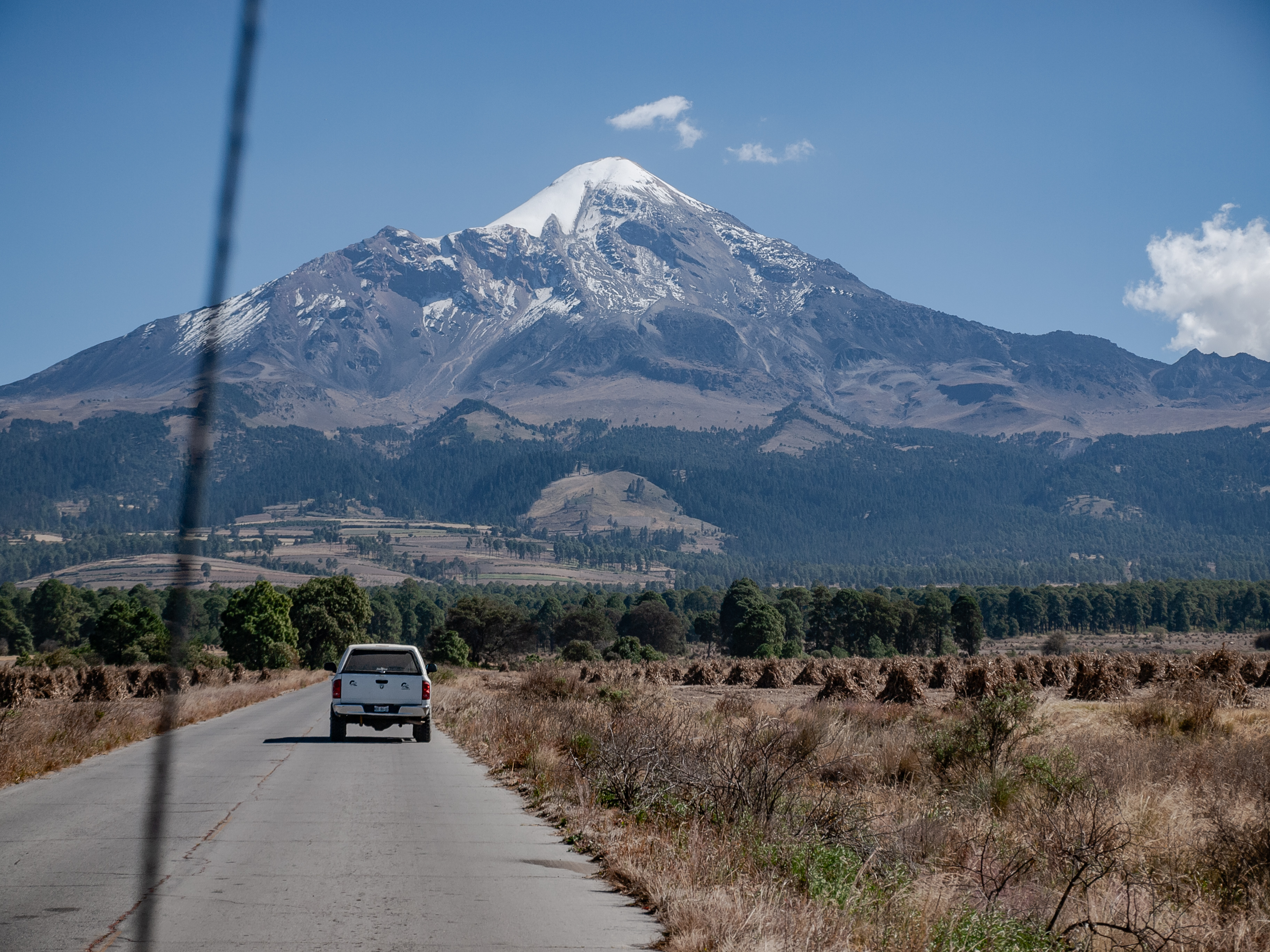 Pico de Orizaba from the road — snow-capped peak above the high plateau