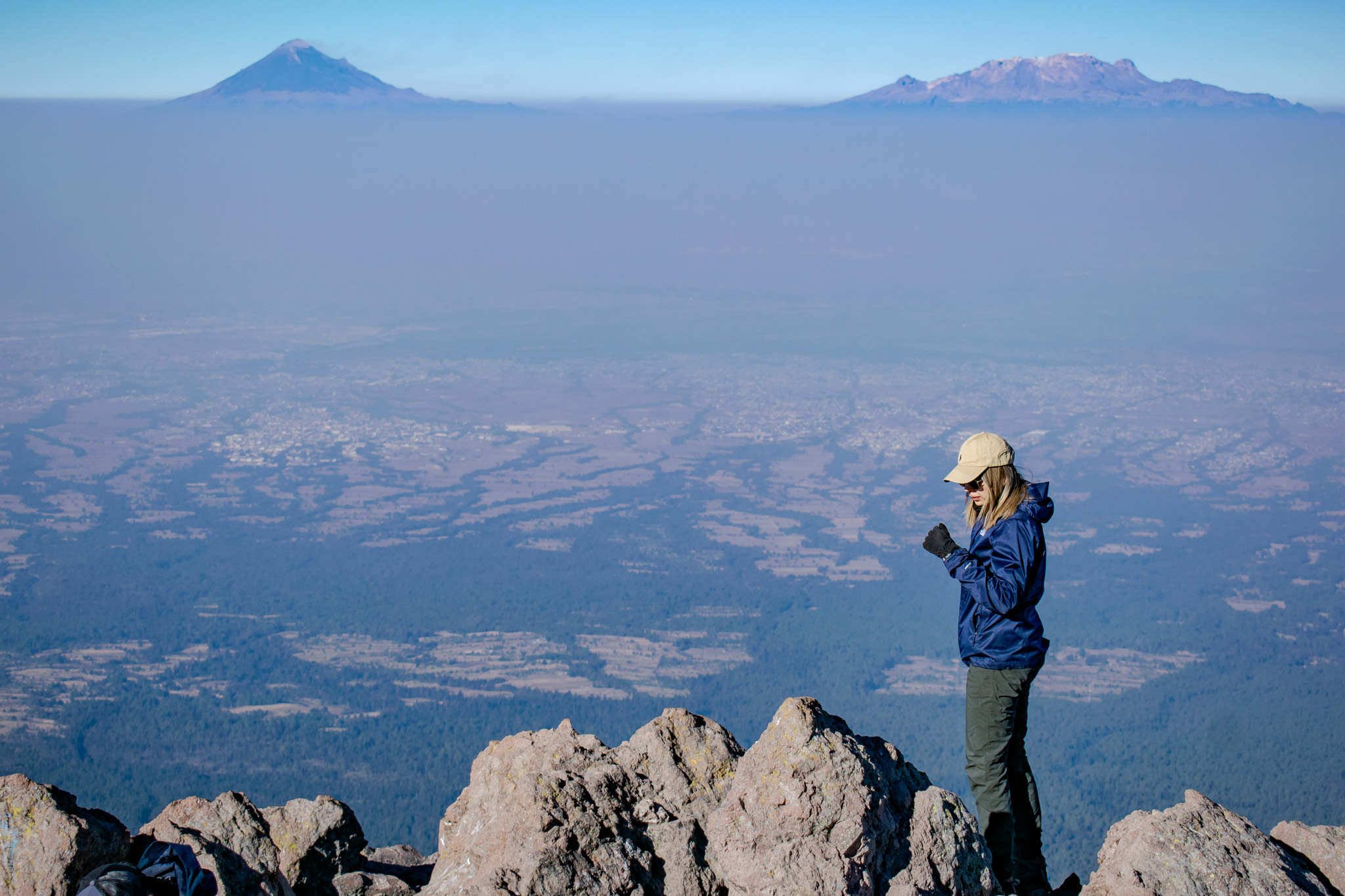Trail through golden meadow toward the volcano — acclimatization day