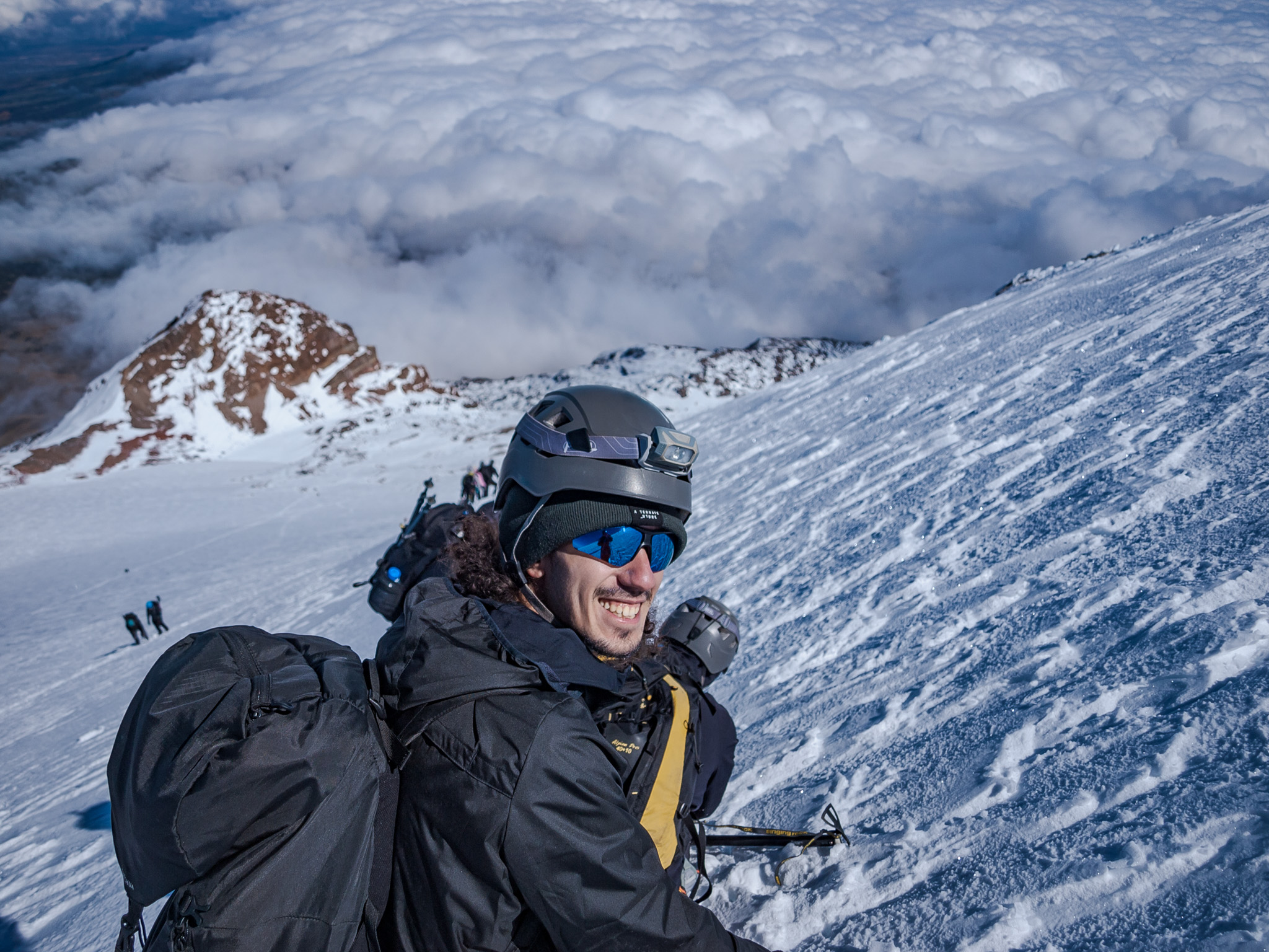 Guided climbing group on volcanic terrain