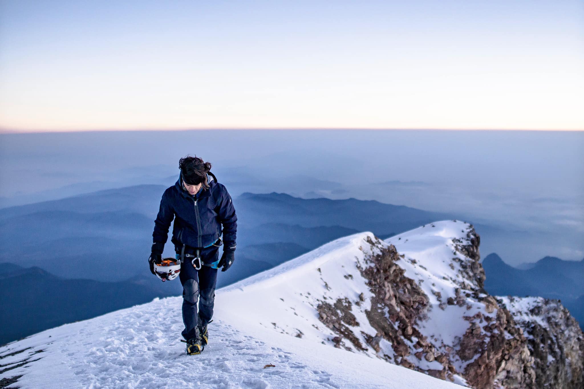 Guided group ascending the Pico de Orizaba glacier at golden hour